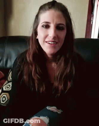 Woman Smiling On Couch GIF