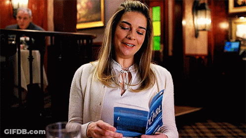 Woman Smiling Reading Pearl Book GIF