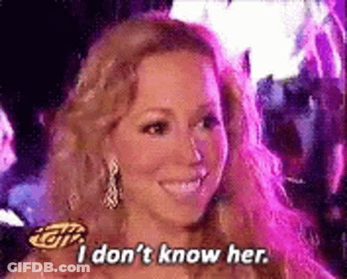 Woman Smiling Saying I Don't Know Her GIF