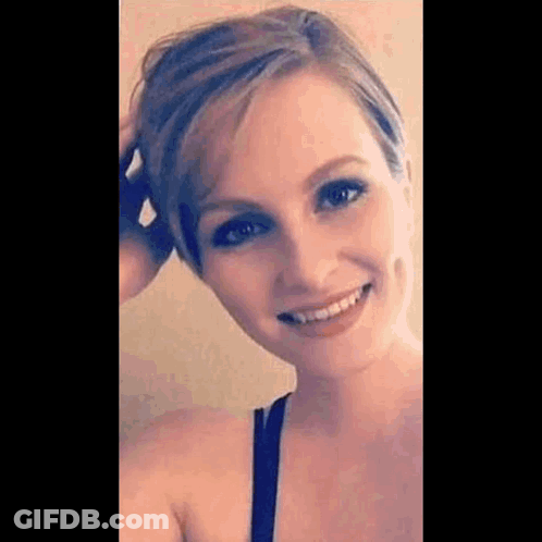 Woman Smiling Touching Hair GIF