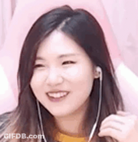 Woman Smiling Wearing Earbuds GIF