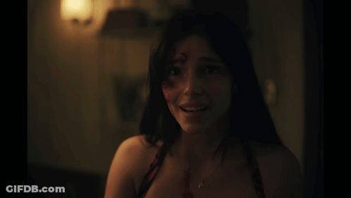 Woman Smiling With Blood On Face GIF