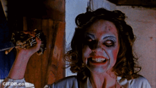 Woman Smiling With Blood On Face GIF