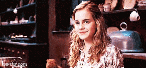 Woman Smiling With Cat On Lap GIF