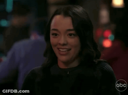 Woman Smiling With Closed Eyes And Open Mouth GIF