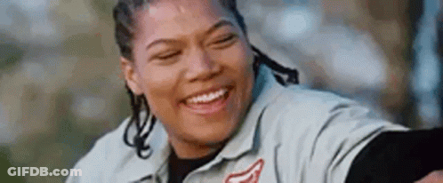 Woman Smiling With Eyes Closed In Gray Shirt GIF