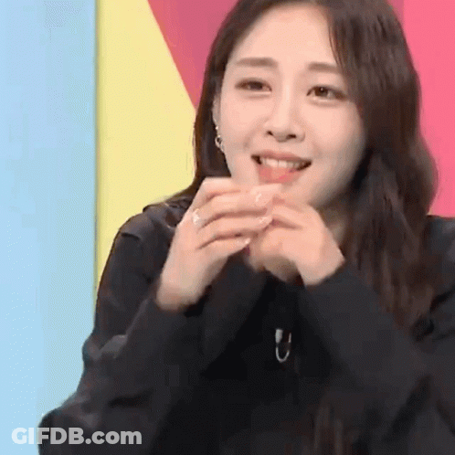 Woman Smiling With Hands Folded GIF