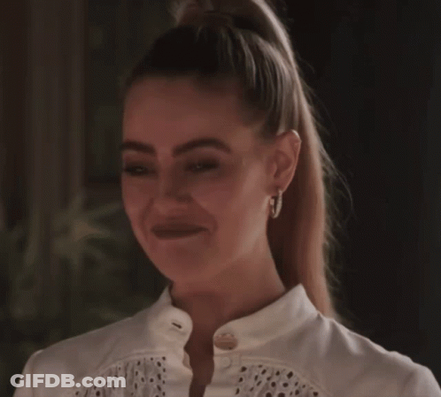 Woman Smiling With Hoop Earrings And Ponytail GIF