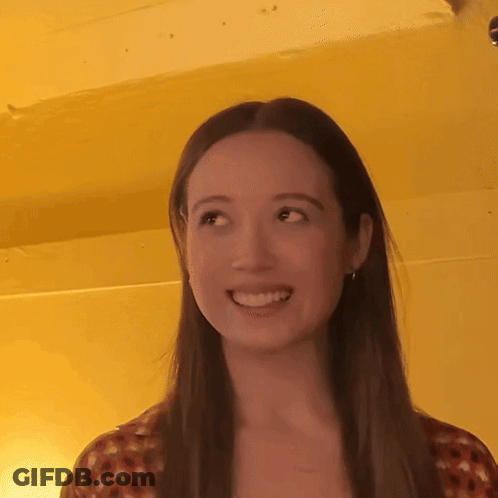 Woman Smiling With Long Hair Yellow Background GIF