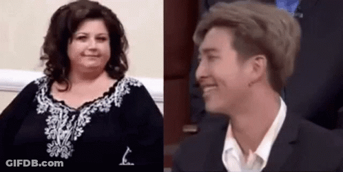 Woman Smiling With Man In Suit And Tie GIF