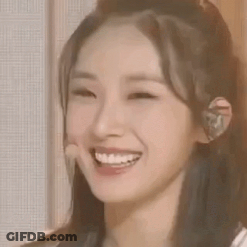 Woman Smiling With Microphone In Ear GIF