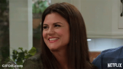 Woman Smiling With Netflix Logo GIF
