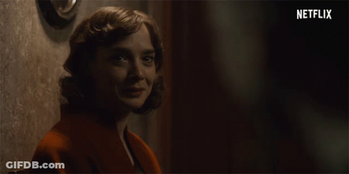 Woman Smiling With Netflix Logo GIF