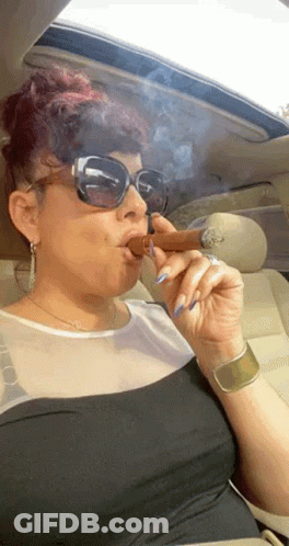 Woman Smoking Cigar With Tongue Out GIF