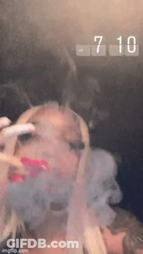 Woman Smoking Cigarette Clock 7:10 PM GIF