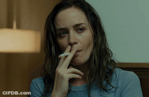 Woman Smoking Cigarette Hand On Nose GIF