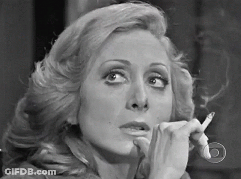Woman Smoking Cigarette In Black And White GIF