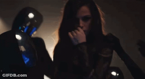 Woman Smoking Cigarette In Dark Room With Man GIF