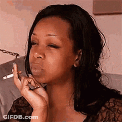 Woman Smoking Cigarette Looking At Phone GIF