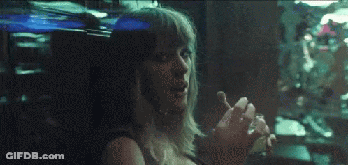 Woman Smoking Cigarette Looking Out Dark Window GIF