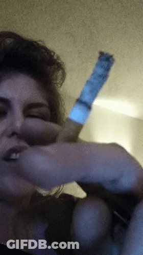 Woman Smoking Cigarette With Blue Label GIF