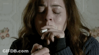 Woman Smoking Cigarette With Eyes Closed GIF