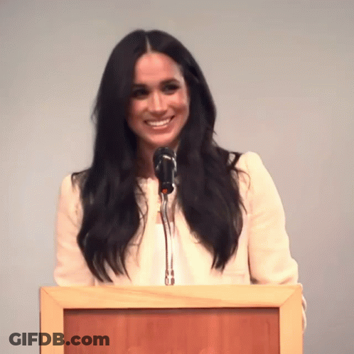 Woman Speaking Into Microphone At Podium GIF
