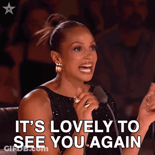Woman Speaking Into Microphone Saying It's Lovely To See You Again GIF