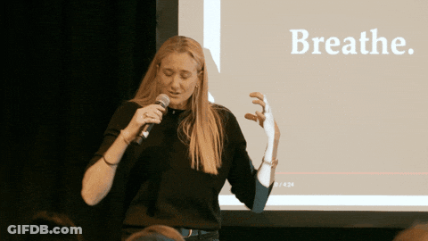Woman Speaking Into Microphone With Breathe GIF