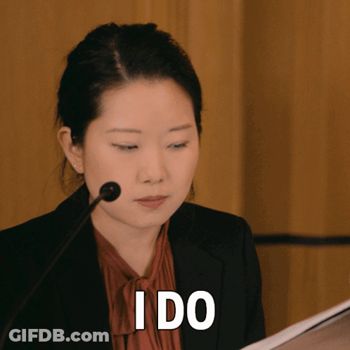 Woman Speaking Into Microphone With I Do Above Her Head GIF