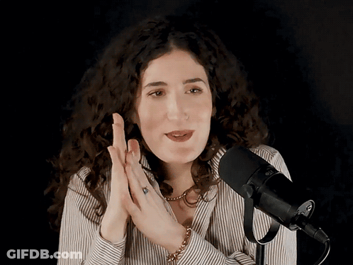 Woman Speaking Into Rode Microphone GIF