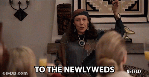 Woman Speaking To Newlyweds GIF