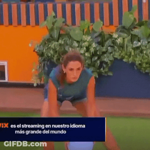 Woman Squatting In Front Of Netflix Sign GIF