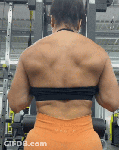 Woman Squatting In Gym Showing Muscles GIF