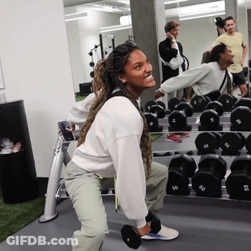 Woman Squatting With 50 Dumbbell GIF
