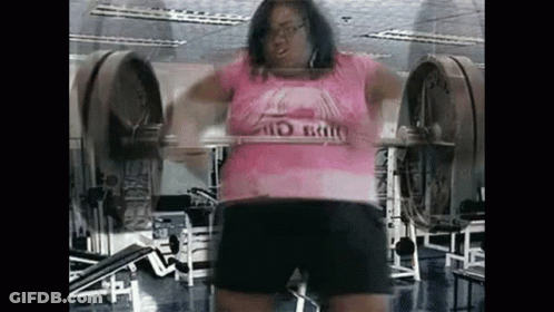 Woman Squatting With Barbell In Gym GIF