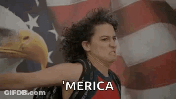 Woman Standing Before American Flag With Bald Eagle GIF