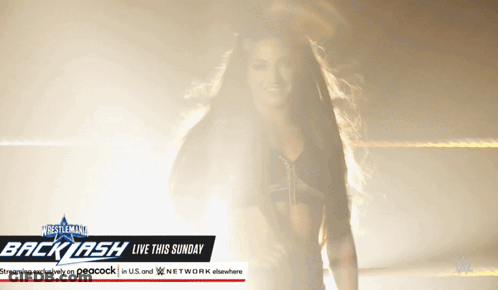 Woman Standing Before Backlash Sign GIF