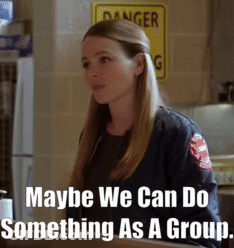 Woman Standing Before Danger Sign GIF