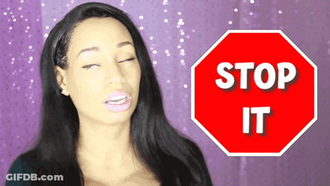 Woman Standing Before Stop Sign GIF