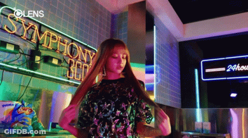 Woman Standing Before Symphony 360 Neon GIF