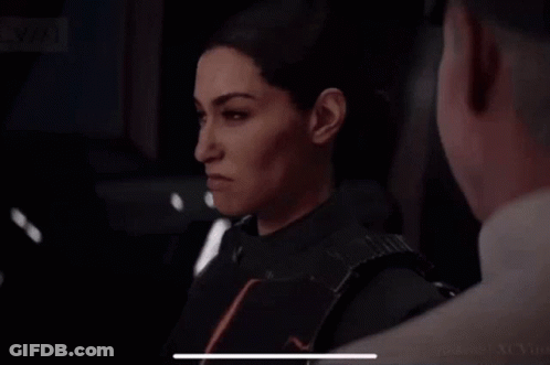 Woman Standing Beside Man In Dark Room GIF