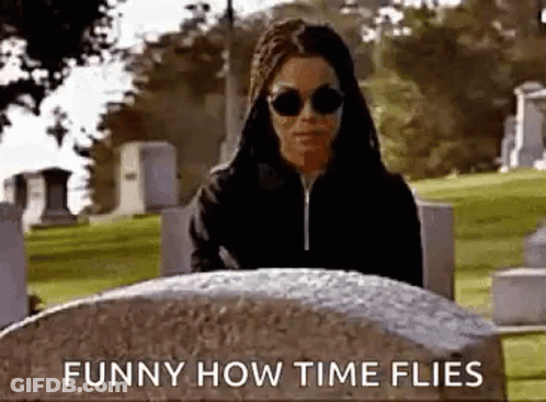 Woman Standing By Grave In Cemetery GIF