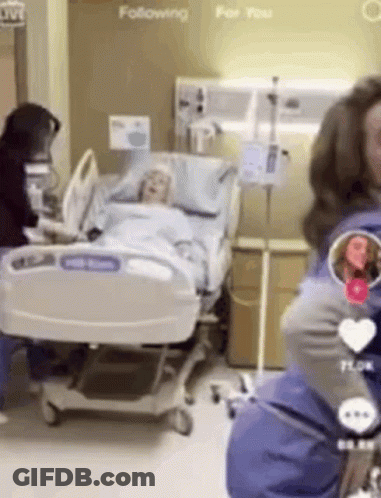 Woman Standing By Hospital Bed GIF