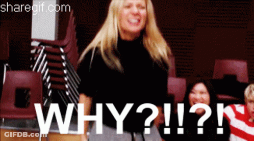 Woman Standing By Stack Of Chairs Saying Why GIF