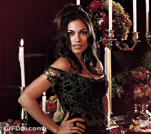Woman Standing By Table With Candles And Fruit GIF