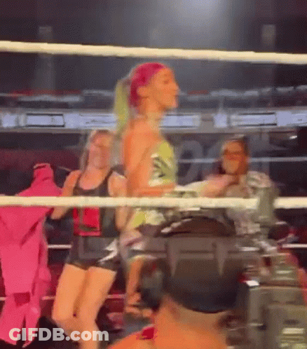 Woman Standing In Boxing Ring With Camera GIF