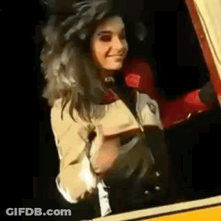 Woman Standing In Car Looking Out GIF