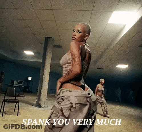 Woman Standing In Dark Room Spank You Very Much GIF
