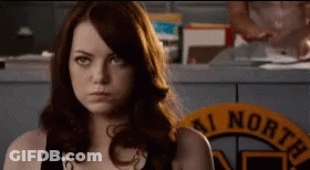 Woman Standing In Front Of AI North Sign GIF